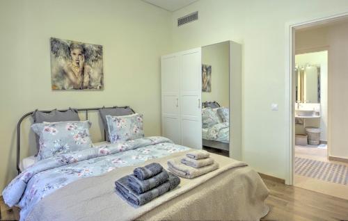 a bedroom with a bed with towels on it at Stylish and cozy house in Athens, Plaka in Athens
