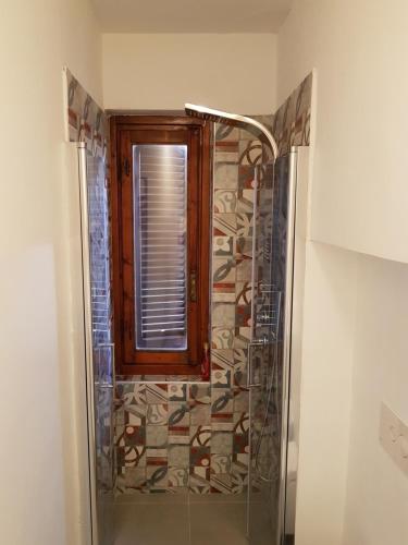 a shower with a window and a glass door at Allegra Toscana - Affittacamere Guest house Arezzo in Arezzo