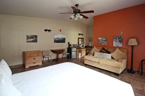 a bedroom with a bed and a living room at Hidden Canyon Retreat in Baker