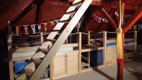 two bunk beds in a room with flags at 14 Century Water Mill in Mořina