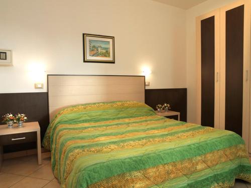 Postel nebo postele na pokoji v ubytování Residence Eurogarden