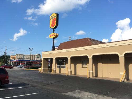 a fast food restaurant with a sign on the side of a building at Super 8 by Wyndham Augusta in Augusta