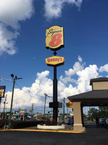 a sign for adonalds restaurant in front of a gas station at Super 8 by Wyndham Augusta in Augusta