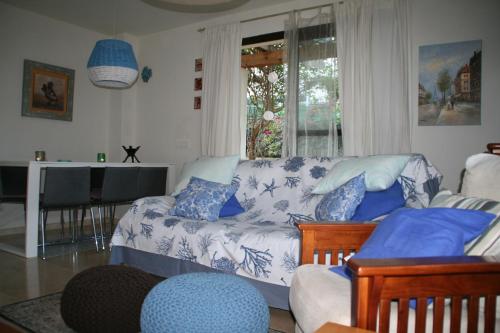 a living room with a couch and a window at You & Me in Jávea