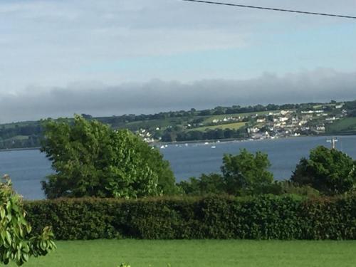 a view of the water with boats in the distance at Redington House SelfCatering accommodation in Cobh