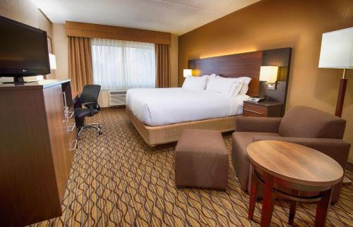 a hotel room with a bed and a television at Grand Canyon Hotel & Suites in Tusayan