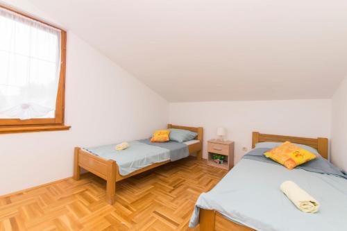 Posteľ alebo postele v izbe v ubytovaní House Iva