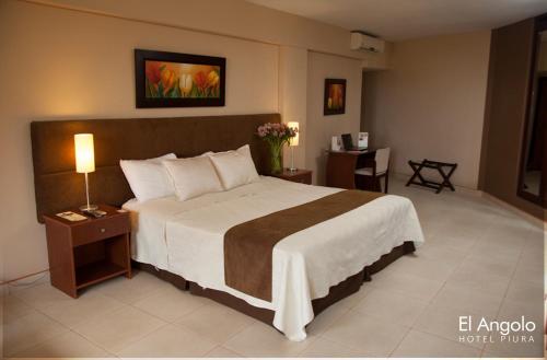 A bed or beds in a room at El Angolo Piura