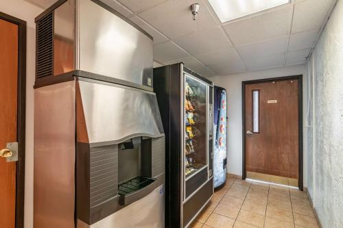 a large stainless steel refrigerator in a hallway at Motel 6-Naperville, IL in Naperville