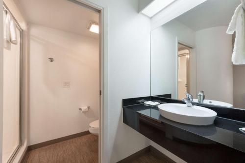 a bathroom with a sink and a toilet at Motel 6-Dallas, TX - Northeast in Garland