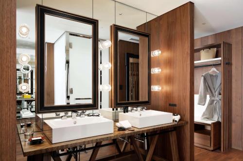 a bathroom with two sinks and a mirror at Hyatt Centric Ginza Tokyo in Tokyo