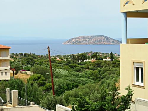 a view of the ocean from a house at Thimari Sports & Spa with private pool and jacuzzi in Sounio