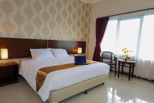 Voodi või voodid majutusasutuse Gerbera hotel toas