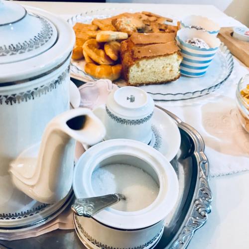 a table with a plate of food and a cup of coffee at B&B Colle di Terria Country House in Contigliano