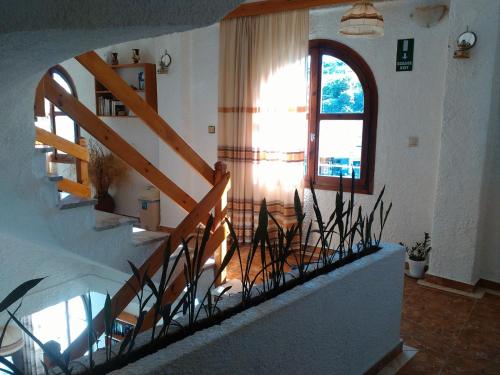 a staircase in a house with a window at Lefka in Kolymvari