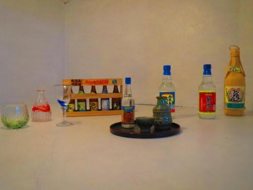 a group of bottles and glasses on a table at Stella Resort in Naha