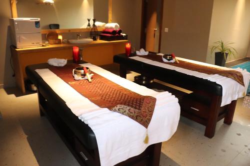 a hospital room with two beds and a counter at Swosti Chilika Resort in Kānāipur