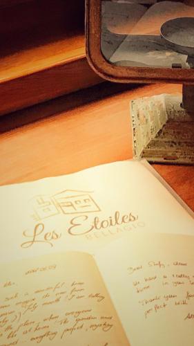 a piece of paper with writing on it next to a box at Bellagio Les Etoiles in Bellagio