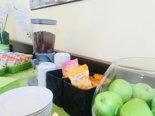 a counter with a bunch of food on a table at Green Park Hotel & Residence in Bagnara Calabra