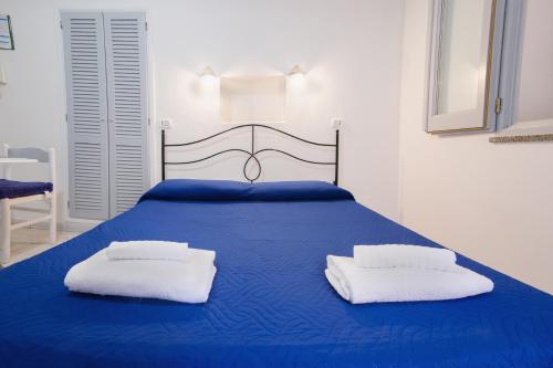 Katil atau katil-katil dalam bilik di Lo Nardo Accommodation