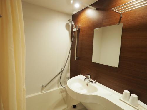 Koupelna v ubytování Haneda Inn