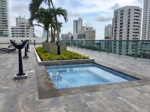 a swimming pool on the roof of a building at luxuriuso apartament in Cartagena de Indias