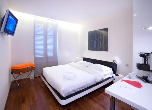 
Cama o camas de una habitación en La Cour Des Augustins Boutique Gallery Design Hotel

