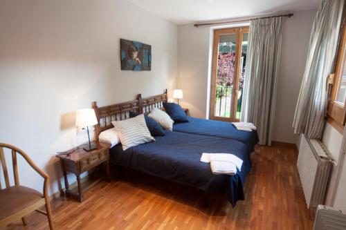 Säng eller sängar i ett rum på Apartaments Cal Noi