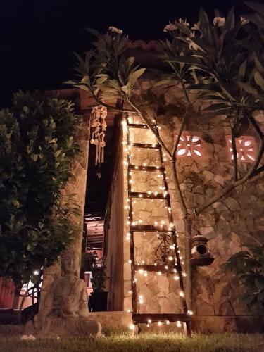 a stairway with lights in front of a building at Casa Dos Patos in Flecheiras