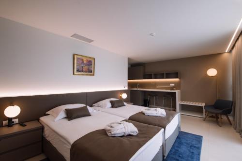 Postel nebo postele na pokoji v ubytování Aparthotel Joel