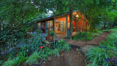 a small house in the middle of a garden at Belle's at Montville in Montville