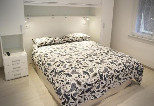 Giường trong phòng chung tại Appartamento L'ONDA - 1 via Provinciale
