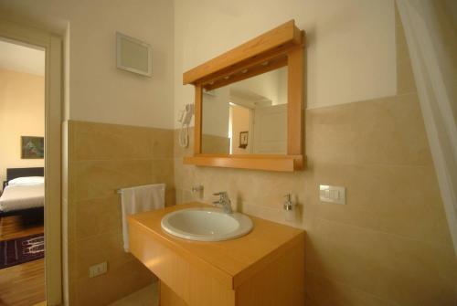 a bathroom with a sink and a mirror at Bed and Breakfast Monterosa in Sesto Calende