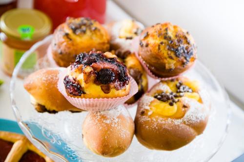 a glass plate with a bunch of pastries on it at B&B Da Peo in Porto San Giorgio
