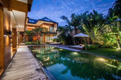 an image of a house with a swimming pool at Eko Villa Seminyak in Seminyak