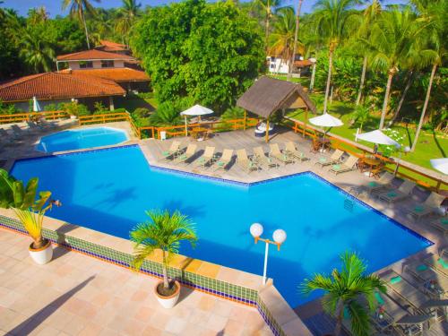 an overhead view of a swimming pool at a resort at Village Paraíso Tropical in Morro de São Paulo