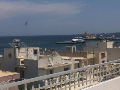 a view of the ocean from the balcony of a building at Popi Studios in Kos Town