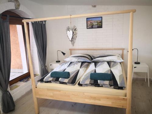 Postel nebo postele na pokoji v ubytování Apartmán Lípa Mikulov