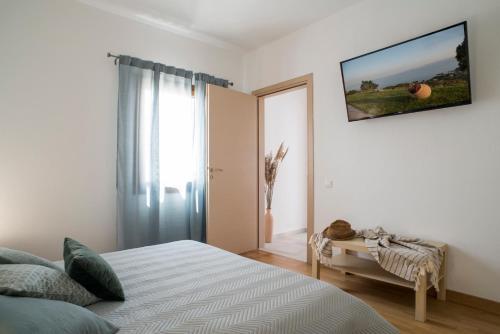 Postel nebo postele na pokoji v ubytování Skiathea Villas