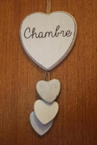a heart ornament with the word chanime on it at Chambre d'Hôtes au Sargaillon in Pouillon