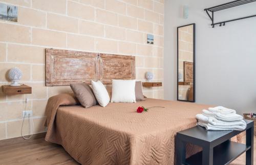 Ένα ή περισσότερα κρεβάτια σε δωμάτιο στο La Creta b&b