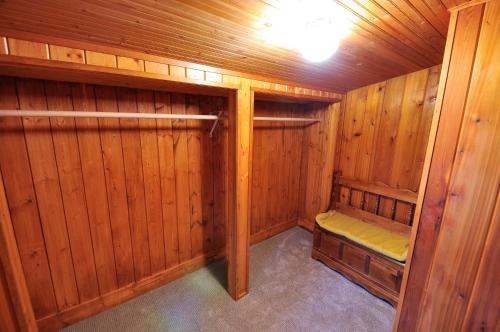 a sauna with wooden walls and wood paneling at Glacier Homestead in Coram