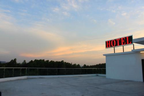 a hotel sign sitting on top of a building at Hotel Time Boutique Nilai in Nilai