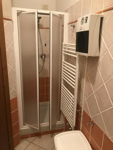 a bathroom with a shower and a toilet at Casa Viareggio in Viareggio