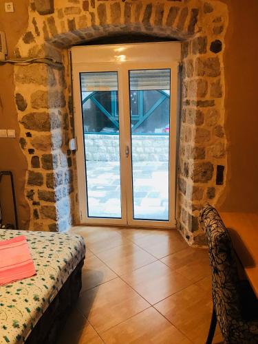 Ένα ή περισσότερα κρεβάτια σε δωμάτιο στο Apartments Sneža