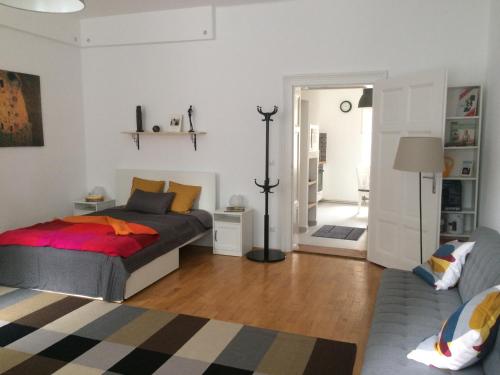 A bed or beds in a room at Enjoy Apartman