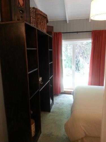 Ένα ή περισσότερα κρεβάτια σε δωμάτιο στο Hostería La Casa de Eugenia
