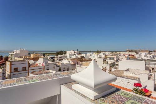a view of a city from the roof of a building at AL - Alojamento Local Pension Bicuar in Olhão