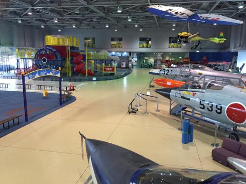 a museum with airplanes and planes on display at Hotel Airport Komatsu in Komatsu