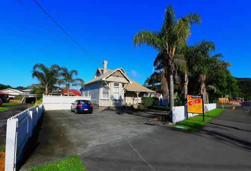 a house with a car parked in a driveway at Regent Residential Villa in Whangarei